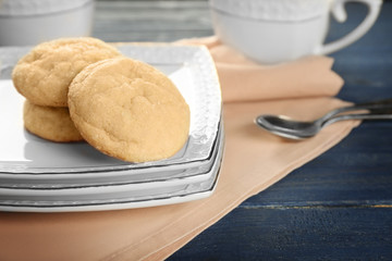 Tasty sugar cookies on plates, closeup