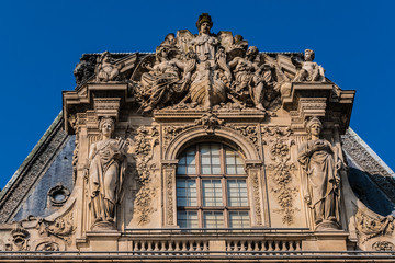 Fototapeta na wymiar Fragments of Louvre buildings in Louvre Museum. Paris, France.