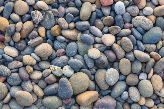 Small sea stones, gravel. Background. Textures	