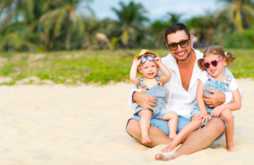 father's day. Dad and children playing together outdoors on a summer