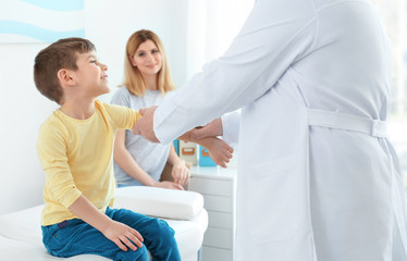 Little boy with mother at orthopedist's office