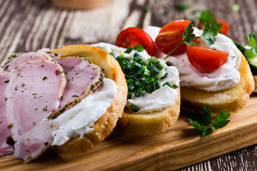 Assorted sandwiches  with cream cheese, ham,cucumber, tomato and green onion