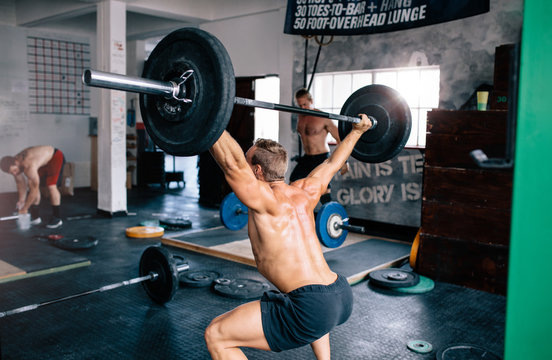 Man weightlifting in gym