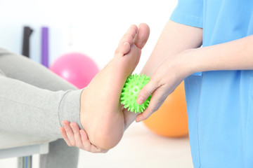 Orthopedist working with patient in clinic, closeup