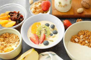 Composition with tasty yogurt and different products on table, closeup
