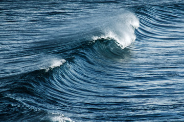 Big stormy ocean wave. Blue water background