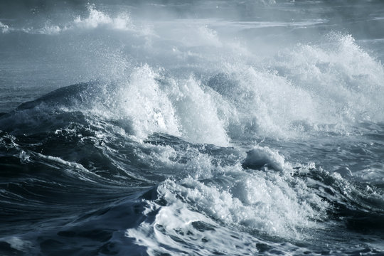 Fototapeta Big stormy ocean wave. Blue water background