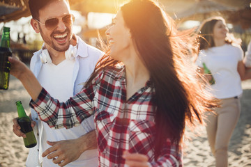 Group of happy young people enjoying summer vacation