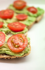 healthy sandwiches with guacamole and tomato