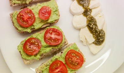 sandwiches with guacamole and tomato mozzarella cheese