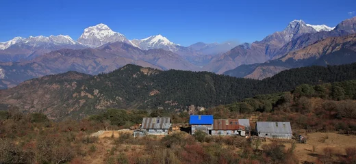Papier Peint photo Dhaulagiri Scene on the way to Mohare Danda, Nepal. Dhaulagiri range and Nilgiri. Simple hotels.