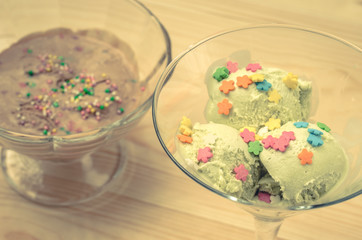 chocolate and pistachio ice cream in a glass/two glasses beautiful ice creams