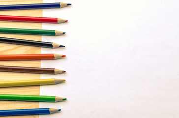 colored pencils and the sheet of paper/colored pencils and the sheet of paper for the text