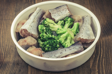cooking of fish with broccoli top view/cooking of fish with broccoli in a plate