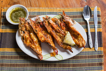 Grilled tiger prawns in a plate, close up