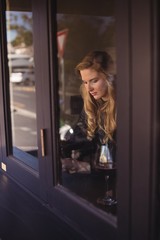 Woman sitting in restaurant