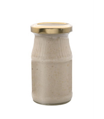 Root of horseradish, a can of spices on a white background. Isolated