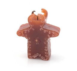 Old burnt candle on a white background