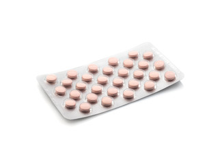 Medicinal pink pills with expired shelf life on a white background. Isolated