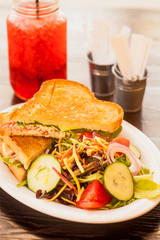 turkey brie melt with garden salad and a glass of  black cherry tarragon soda