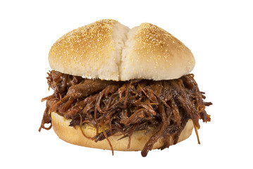 Close up on pulled pork sandwich isolated on white background.