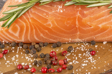 Delicious portion of fresh salmon fillet with aromatic herbs