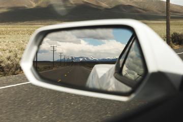 Mountains in Side Mirror View on Sports Car - obrazy, fototapety, plakaty