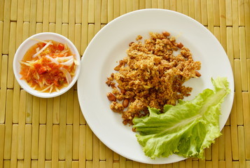 crispy fried chop catfish with green mango salad and sauce