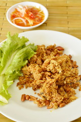 crispy fried chop catfish with green mango salad and sauce