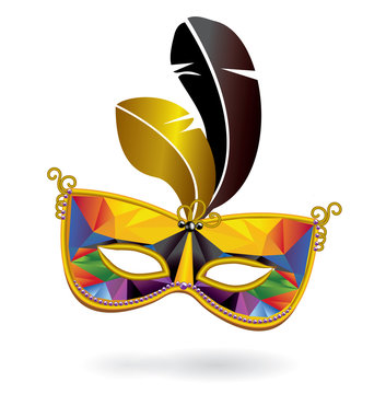 Multicolored carnival mask and feathers on white background. Triangle pattern on surface of mask