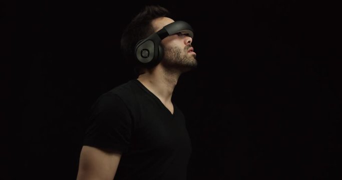 Man wearing virtual reality headset looks around in awe at 360 digital world