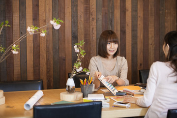 business women are doing product planning meeting