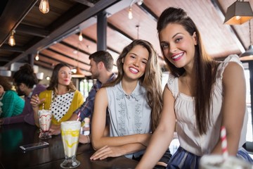 Female friends sitting at restaurant