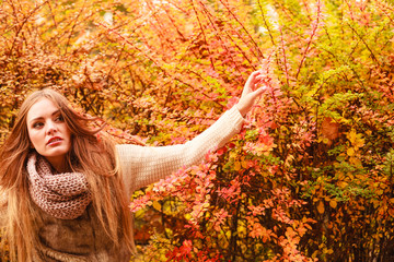 Woman walking in park during autumn