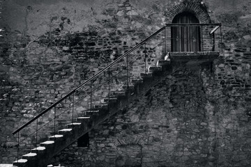 Black and white image of an old medieval staircase