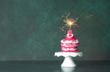 Birthday cake sparkler decoration dark background vintage