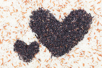 Rice-berry, two black hearts In brown rice