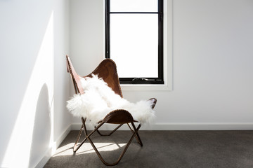 Gorgeous leather occasional chair with scandi style sheepskin