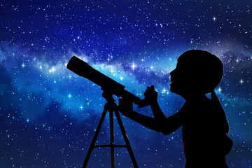 Silhouette of little girl looking through a telescope © Tan Kian Khoon