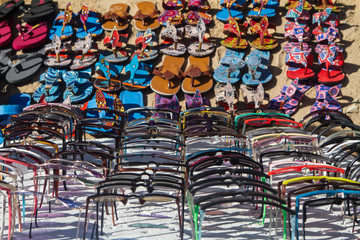 shoes and glasses on beach