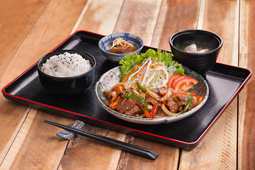 Japanese meal tray with rice, soup and sauteed beef with salad