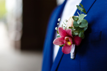 stylish buttonhole of the groom from rose