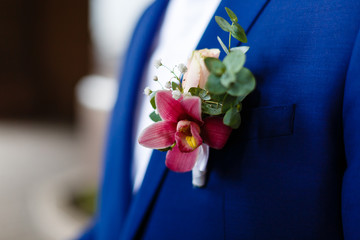 stylish buttonhole of the groom from rose