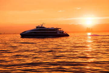 Fototapeta na wymiar A yacht against the backdrop of sunset. The Sea of Marmara. Istanbul. Turkey