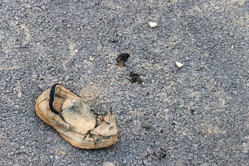 Fototapeta na wymiar Old destroyed shoe
