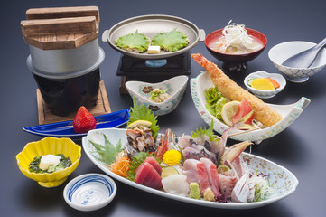 Japanese special meal with sushi tuna, shrimp, shell, fried fish, and seaweed soup