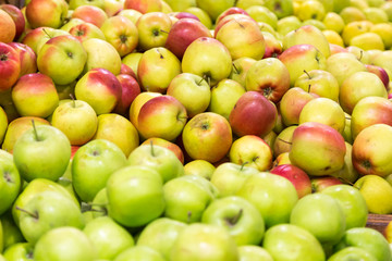 Mountain of red and green apples on the market