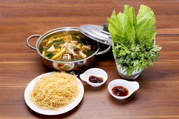 Prepared hot pot of beef with cabbage, pasta and fish sauce