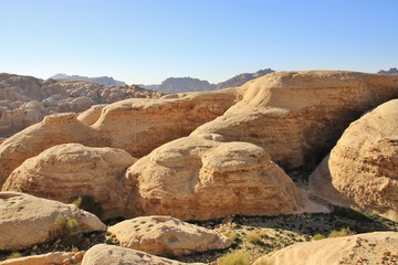Fototapeta na wymiar Big unusual form sandstones outside of Petra, Jordan, Middle East