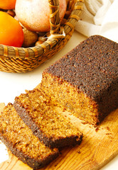 Carrot cake from pea flour on wooden cutting board